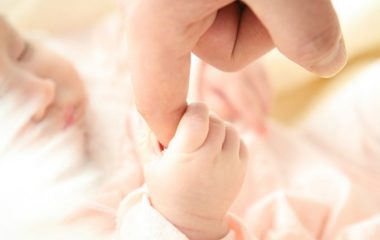 baby-holding-person-s-index-finger-64242