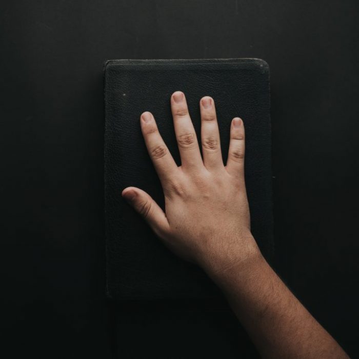 man-touching-book-2258252