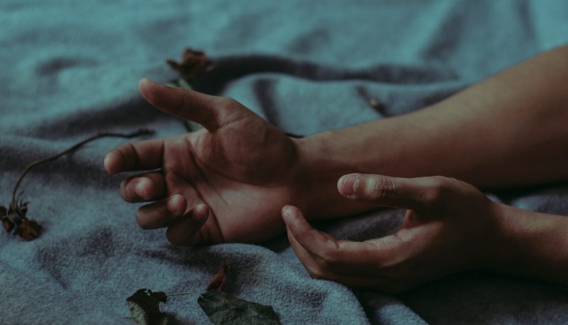 person-lying-on-gray-textile-917481