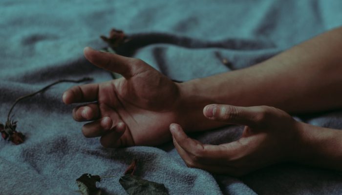 person-lying-on-gray-textile-917481