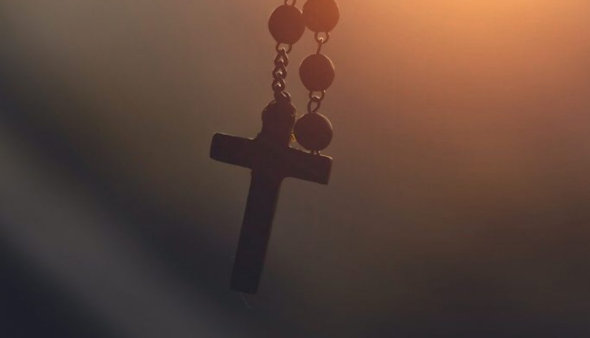 silhouette-photography-of-hanging-rosary-2081128