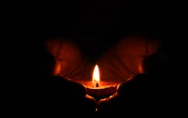 tealight-candle-on-human-palms-783200